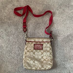 Coach crossbody purse with red details